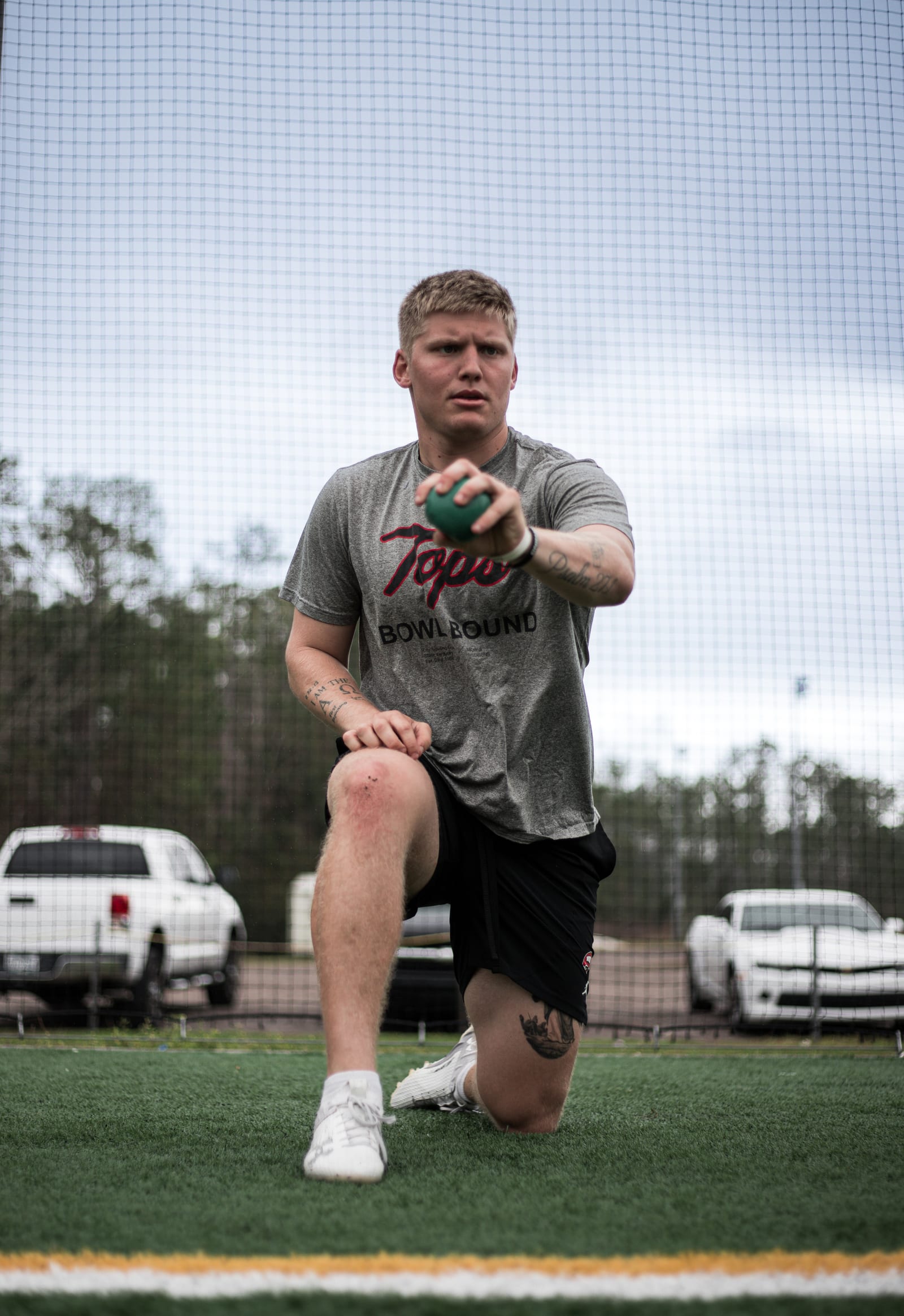 College quarterback throwing