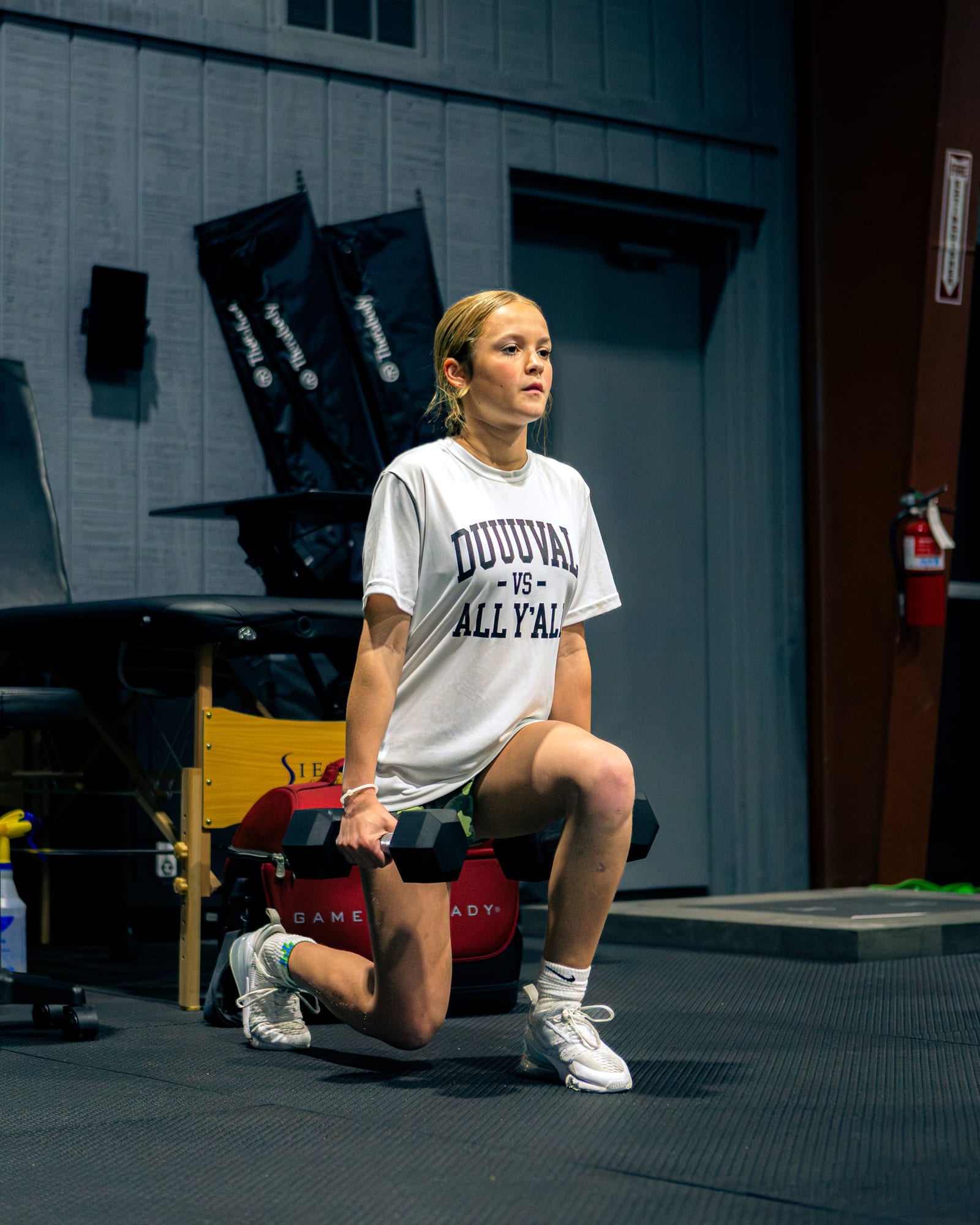 Younger athlete with weighted lunges